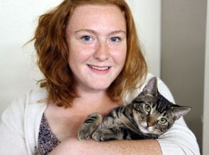 Hannah holding a tabby cat